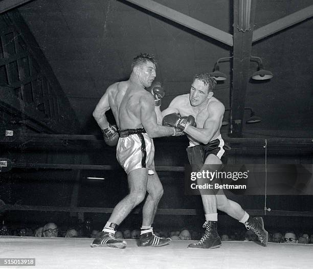 Gene Fullmer Utah's undefeated middleweight moves in with a right to the jaw of Peter Mueller in the 6th round of their featured bout at the Garden....