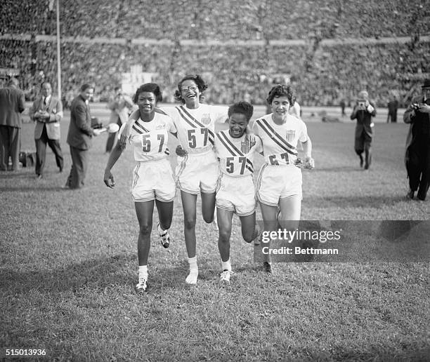 The US women's 4×100 metres relay team, winners of the event, at the Olympic Stadium during the Summer Olympics in Helsinki, 27th July 1952. Left to...