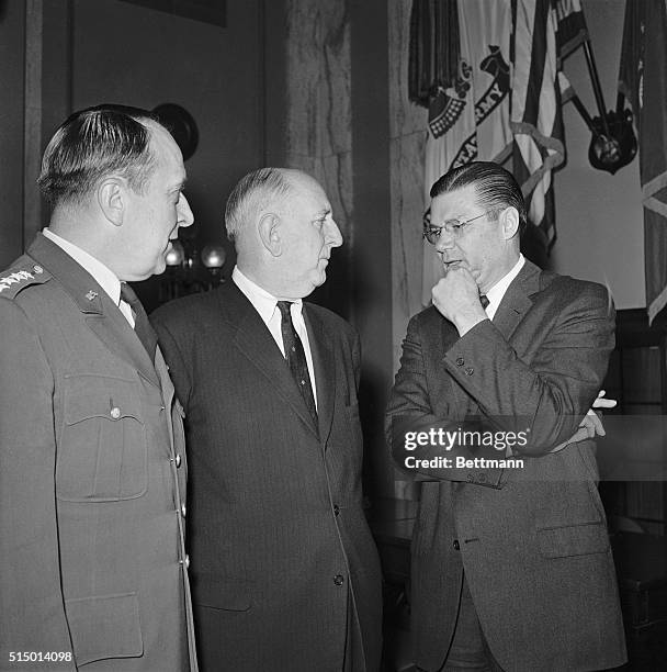 Defense Secretary Robert McNamara, , and General Lyman L. Leminitzer, Chairman of the Joint Chiefs of Staff, , confer with Chairman Richard B....