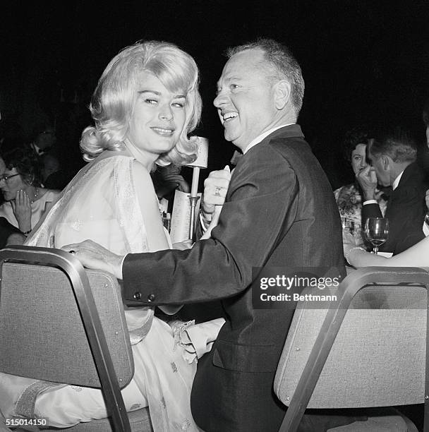 Hollywood, Los Angeles, California: Mickey Rooney and wife are shown as they attended the Golden Globe award ceremonies last night. The award is an...