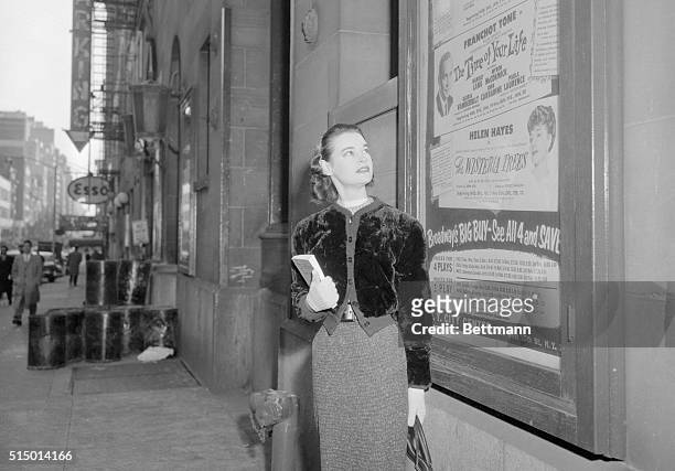 Gloria Vanderbilt Stokowska, scans a billboard at City Center bearing her name, as she began rehearsals today for her role in William Saroyan's The...