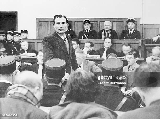 In a tense moment during the trial of 77 year old French farmer Gaston Dominici , Dominici's son, Gustave rises to testify against his father. The...
