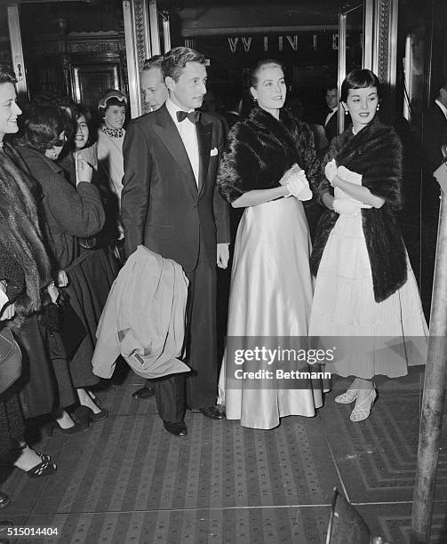 Movie actress Grace Kelly and her then steady escort, dress designer Oleg Cassini, are pictured at the gala premiere of the Napoleonic movie Desiree,...