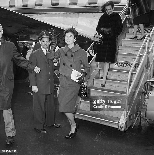Mrs. Jacqueline Kennedy, shown as she arrived at La Guardia Airport, stepped right from the gangway of the plane into a waiting limousine. Mrs....