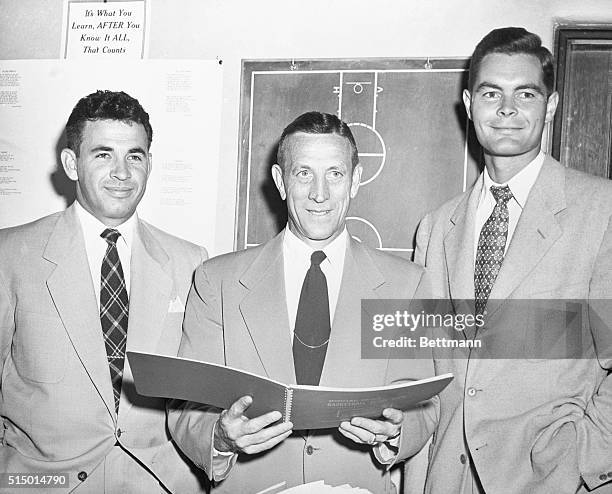 The coaching staff of the UCLA basketball team : Assistant Varsity Coach Ed Powell, Head Varsity Coach John Wooden, and Junior Varsity Coach Al...