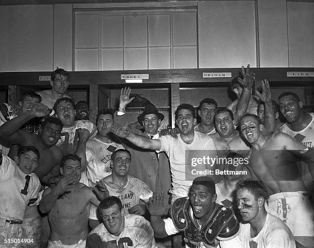 The Cleveland Browns whoop it up in the locker room after their resounding 56-10 win over the Detroit Lions to take the pro title. Quarterback Otto...