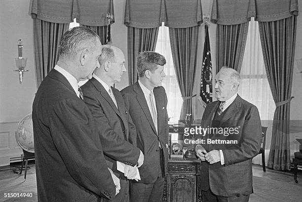 Diplomat Arthur H. Dean meets with President John F. Kennedy, Secretary of State Dean Rusk, and Vice President Lyndon Johnson before leaving to...