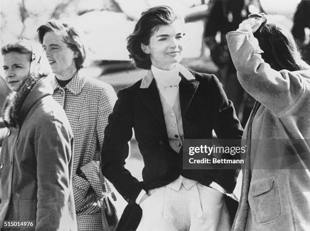 First Lady Jacqueline Kennedy with spectators at the Piedmont Foxhounds Races in Upperville, Virginia. Her husband, President John Kennedy, was in...
