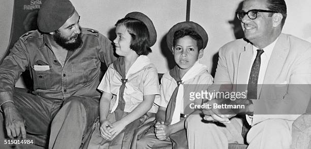 Cuba Premier Fidel Castro and Cuban President Osvaldo Dorticos chat with Margarita Gomez and Julio Fernandez charter members of the "Union of Rebel...