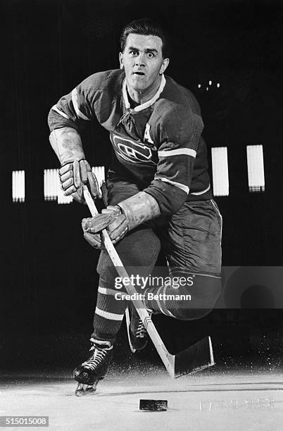 Montreal Canadiens right wing Maurice "The Rocket" Richard controls the puck.