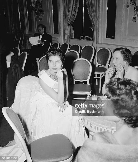 Queen Soraya of Iran makes a sophisticated picture while holding a cigarette at the 25th anniversary dinner of the Near East Foundation at the...