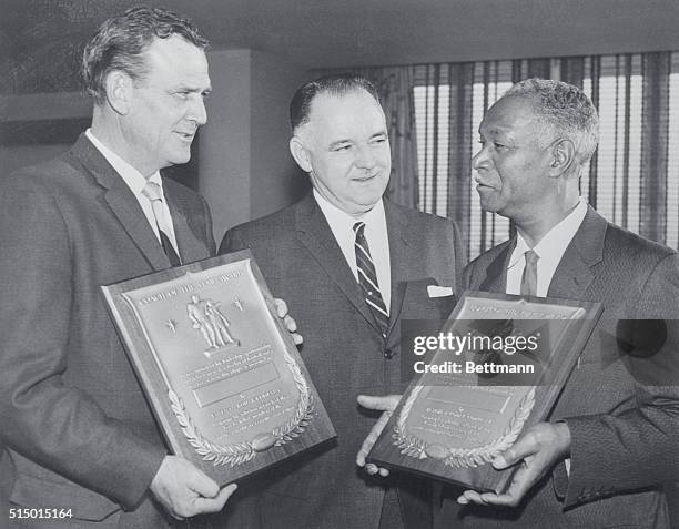 Paul "Bear" Bryant of Alabama, left, and Alonzo "Jake" Gaither of Florida A&M, right, won the Kodak Awards as 1961 Coach of the Year, representing...