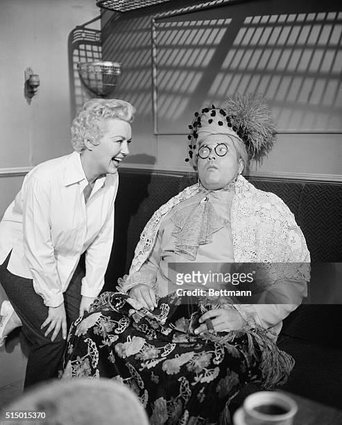 Betty Grable breaks up when she sees co-star Orson Welles in costume for the first time as she and Welles rehearse at CBS Television City in...