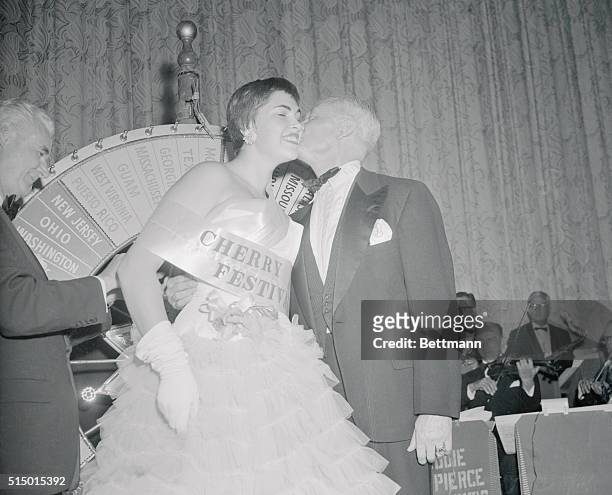 Barbara Lynn, Miss Montana in the Cherry Blossom Festival, receives a crowning kiss from presidential assistant Sherman Adams after she was selected...