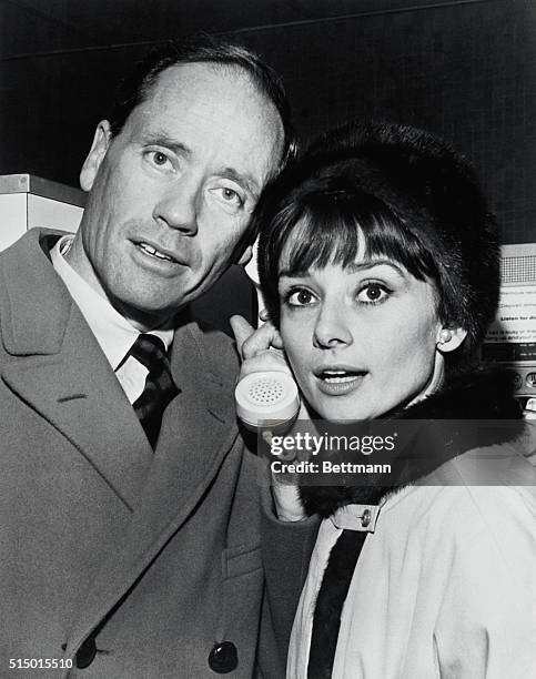 Audrey Hepburn and Mel Ferrer , check some last minute details after arriving from Los Angeles via American Airlines Astrojet. They were headed for...