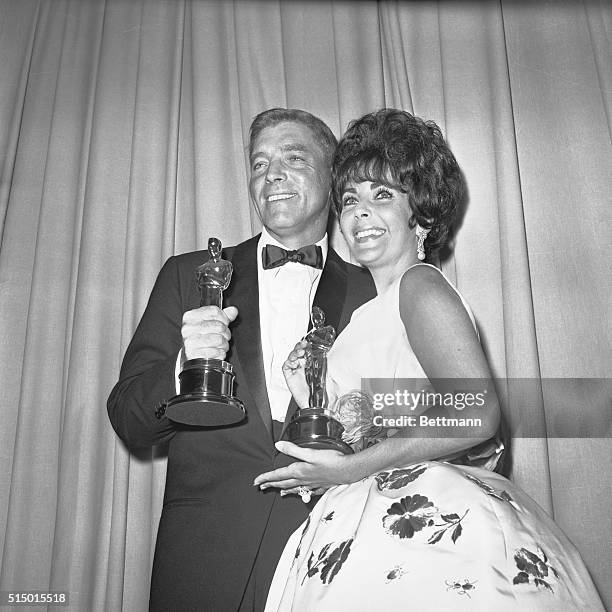 Burt Lancaster and Elizabeth Taylor hold their Academy Awards after the 1961 Academy Awards presentation. Taylor won Best Actress for Butterfield 8,...