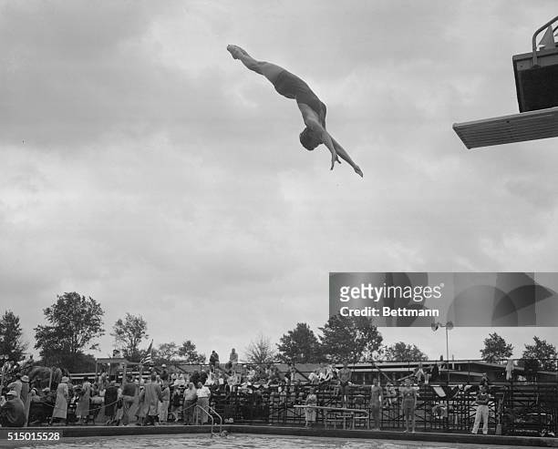 "Form of a Champion." Philadelphia, Pennsylvania: From out of California way 24 year old Mrs. Stover Irwin, Pasadena, Calif., in the platform dive...