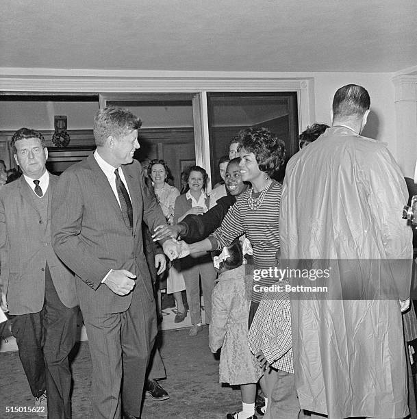 After visit to father. West Palm Beach, FLA.: Johnnie Jones of Riviera Beach, Fla., shakes hands with President Kennedy, and St. Mary's Hospital as...