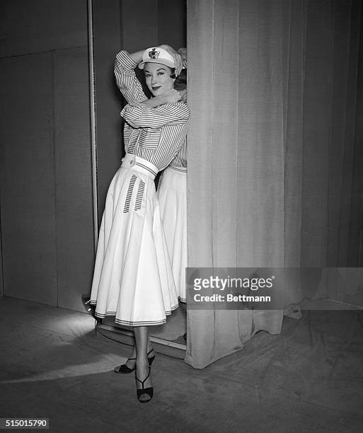 Attention: Women's Page Editor. Paris, France: Coco Chanel has designed this summer outfit for the "sailor-girl." A flaring white linen skirt,...