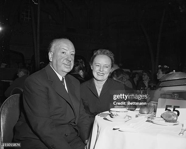 Alfred Hitchcock and his wife, Alma, at their dinner table while waiting for Oscar nominees for Best Director to be announced.