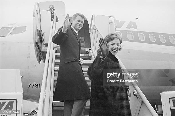Attorney General Robert F.Kennedy and his wife, Ethel, wave from ramp of plane as they prepare to depart from here today on a globe-circling, 26-day...