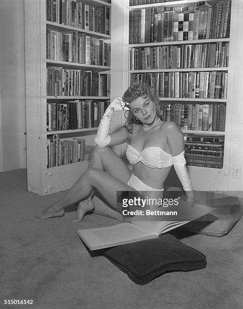 Intellectual Pin Up Girl. Sally - A beauty with brains, says lovely film actress Sally Forrest, ought to be an unbeatable combination in Hollywood....