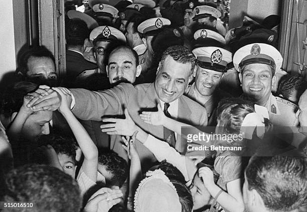 Moslem children greet Egyptian premier. Cairo, Egypt: Egyptian premier Gamal Abdel Nasser, whose government last night unexpectedly announced its...