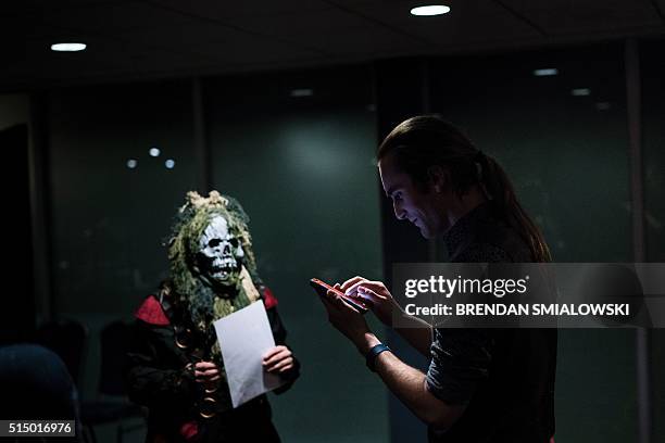 People play live action role-playing games during the Cleveland Concoction in the early morning March 12, 2016 in Cleveland, Ohio. / AFP / Brendan...