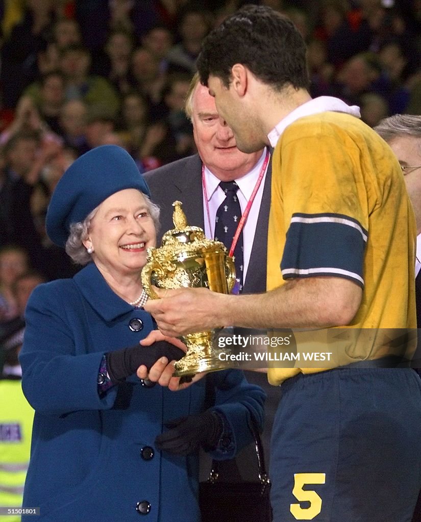 Queen Elizabeth II gives the Webb Ellis trophy to