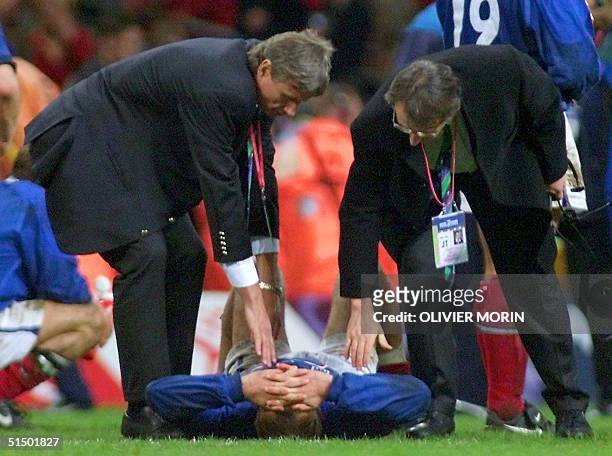 French coach Jean-Claude Skrela and Max Godemet comfort French centre Richard Dourthe after the Rugby World Cup 1999 final game opposing France to...