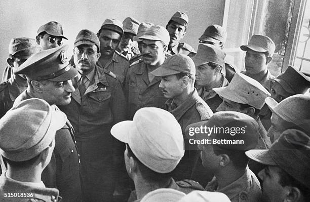 Nasser visits his "commandos" at Gaza. Gaza: Egyptian prime minister Gamal Abdel Nasser is shown surrounded by Egyptian national guardsmen and...