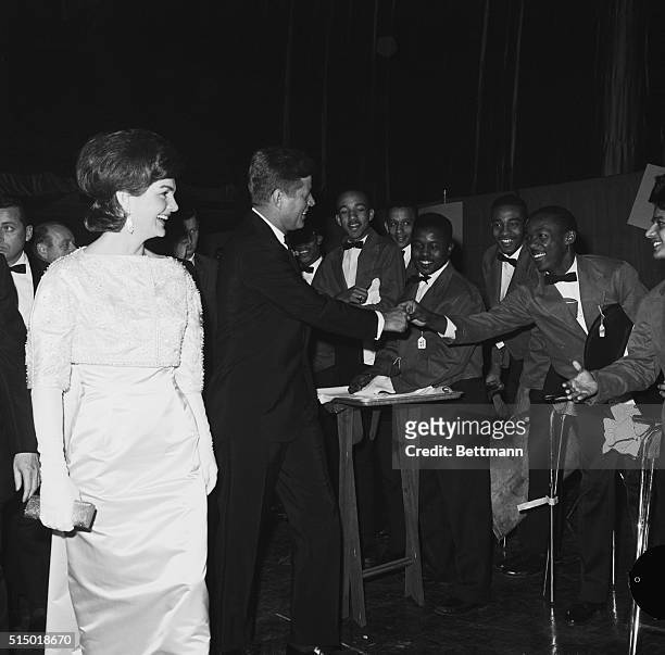 President John F. Kennedy and First Lady Jacqueline Kennedy greet the waiters during a $100-a-plate Democratic fundraising dinner at the National...