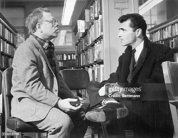 Hollywood Newsreel. Actor Mickey Rooney talks with writer Rod Serling during a break in the location shooting of the film version of Serling's TV...