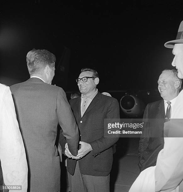 Singer Frankie Lane and President Kennedy shortly before the Presidents departure from this desert resort. A group of nearly two thousand people bade...