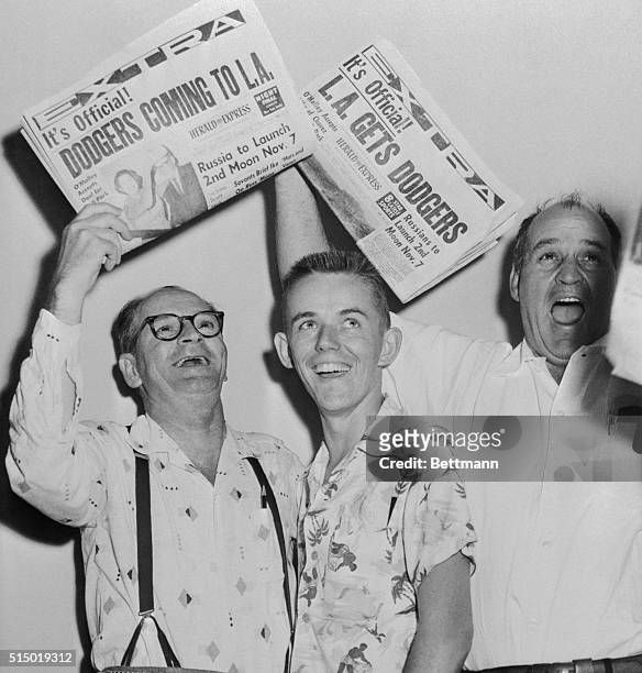 The News that Brooklyn Dodgers will become the Los Angeles Dodgers, here happy fans whoop up for joy. From left, Roy Johnson, Bill Redden and Ben...