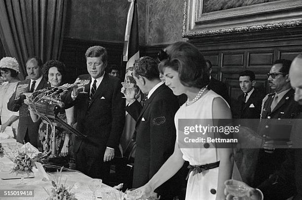 Mexico City: President John F. Kennedy and President Lopez Mateos drink a toast following President Kennedys speech at luncheon in his honor at...