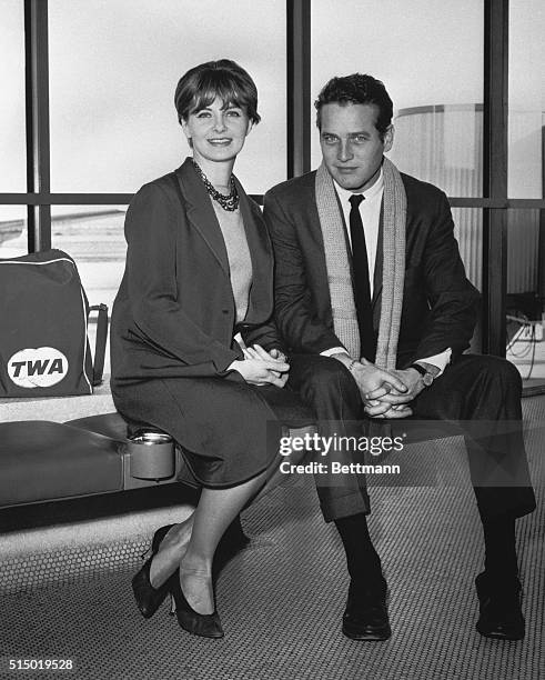 Joanne Woodward and her husband, Paul Newman at the airport about to board plane for Los Angeles where they are to start work on Somantha in which...