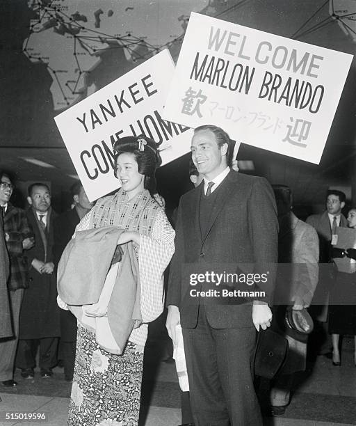 Film Star Marlon Brando arrived in Tokyo late Tuesday night to take the lead in Warner Bros.' "Sayonara," to be filmed here. Miss Kayoko Uchimura...