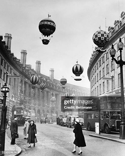 Balloons for Regent Street Xmas Display. London, England: Something new for Regent Street in the way of Christmas decorations appeared this weeks as...