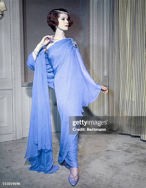 Paris: Athenian blue chiffon is wound, sari-style, about a beaded sheath of the same fabric in the spring collection of Greek-born Parisian designer...