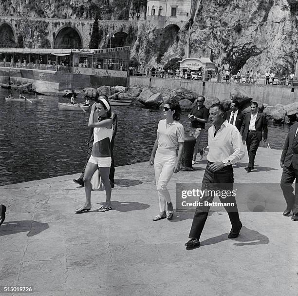 First Lady Jacqueline Kennedy , spending a two-week vacation in Ravello with daughter Caroline, walks with sister Lee Radziwill and Italian auto...