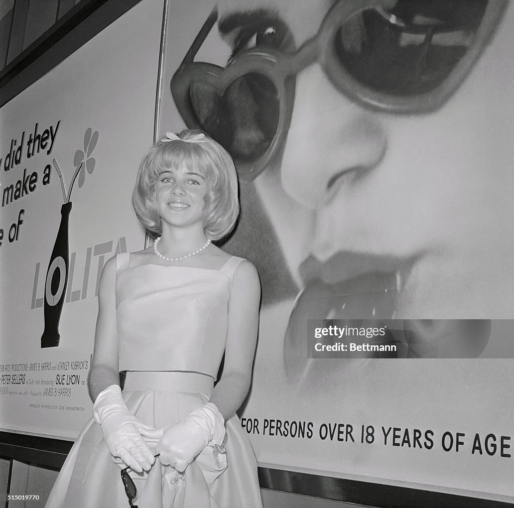 Sue Lyon Standing Before Mural of Herself
