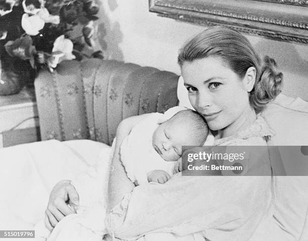 Prince Albert Just Can't Be Bothered. Monaco: Princess Grace of Monaco proudly holds her son, Prince Albert Alexander Louis Pierre, as he makes his...