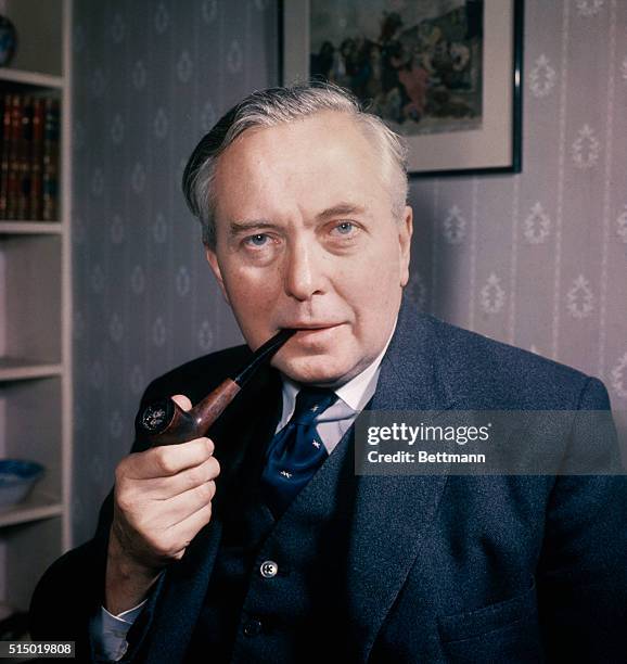 London, England: Harold Wilson, newly-elected head of the British Labor Party, is shown in his London home. Wilson defeated George Brown for the...