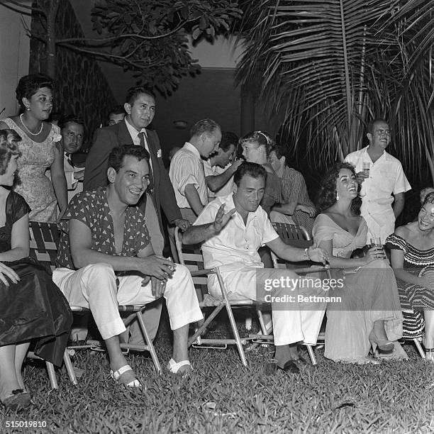 Acapulco, Mexico- Actress, Elizabeth Taylor , and film producer, Michael Todd , enjoy the entertainment at their wedding reception with friends....