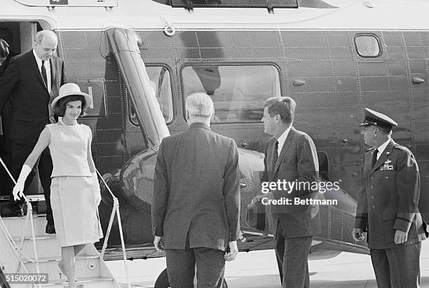 Arriving at Andrews. Andrews Air Force Base, MD.: President and Mrs. Kennedy leave their helicopter after arriving from the White House. They left by...