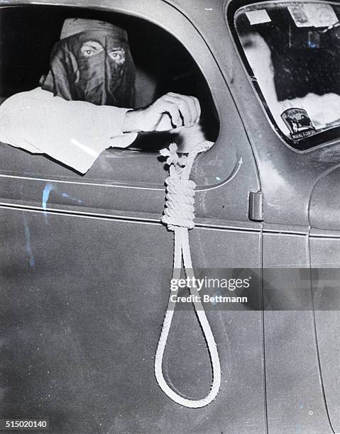 Member of the Ku Klux Klan staged an automobile parade through the negro section of Miami on the eve of the primary election, warning the negro...