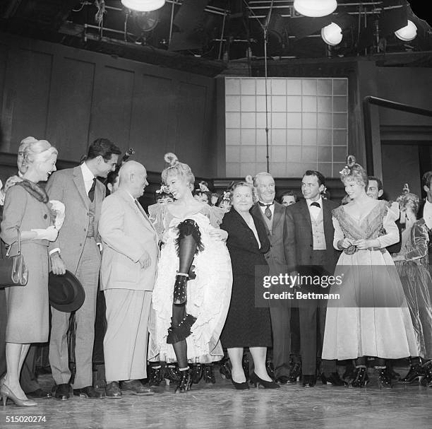 Shirley MacLaine performs like a Can Can girl for Soviet Premier Nikita Khrushchev at the 20th Century Fox Studios. Left to right: Louis Jourden, Mr....