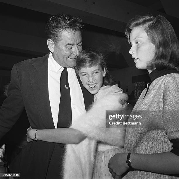 Los Angeles: Actor Errol Flynn, who died in Vancouver, B.C. Hospital late Oct. 14th is shown in a photo made in Beverly Hills, Calif., with his two...