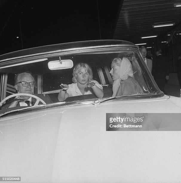 Paris: Steering Clear. Gesturing with her hands, Jenny Ann Lindstrom sits with her mother, actress Ingrid Bergman, and Lars Schmidt, Miss Bergman's...